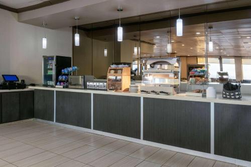 a large kitchen with a counter in a restaurant at Wyndham Corpus Christi Resort North Padre Island in Corpus Christi