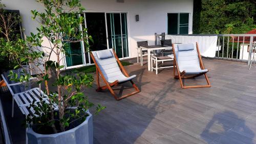 two chairs and a table on a patio at Valley View in Ko Chang