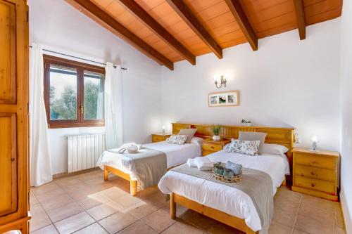 A bed or beds in a room at Son Garrot by dracmallorca