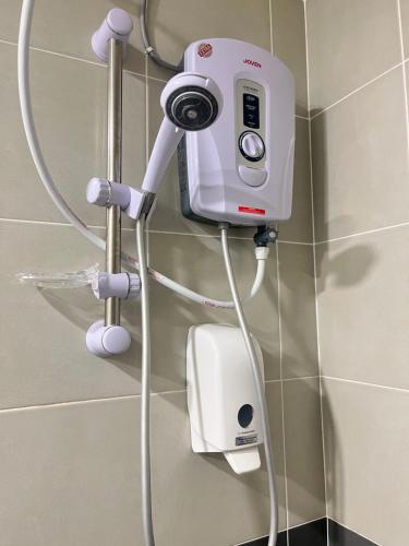 a camera on a wall in a bathroom at Emerald Avenue Cozy 3R3B Apartment 716 in Brinchang