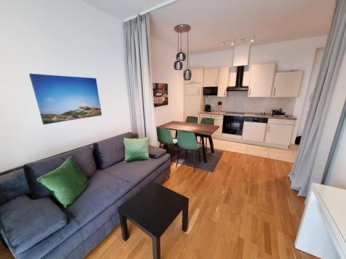 a living room with a couch and a table at City Appartements Villach in Villach