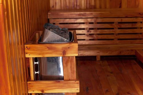 a wooden stand with a tray of rocks on it at The Okaseni Lodge in Arusha