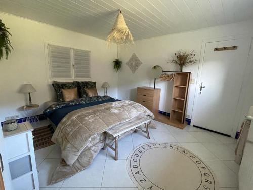 a bedroom with a large bed in a room at GÎTE LA MOUNTAGNA in Peyroules