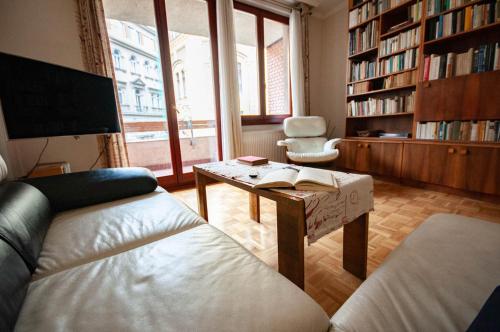 a living room with a couch and a table at Castle Hillside Apartment in Budapest