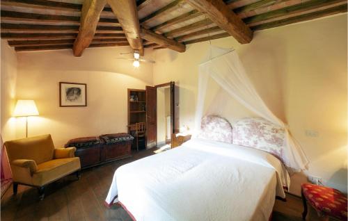a bedroom with a white bed and a chair at Il Colle in Galbino