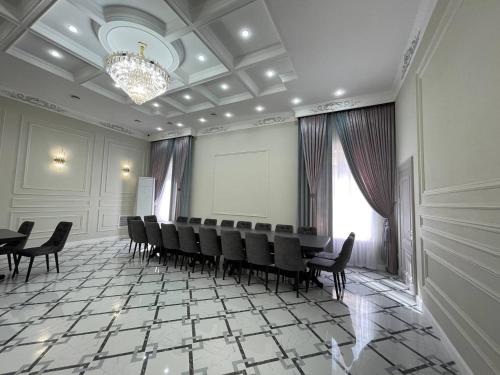 a conference room with chairs and a projection screen at JETISY COMPLEX in Taraz