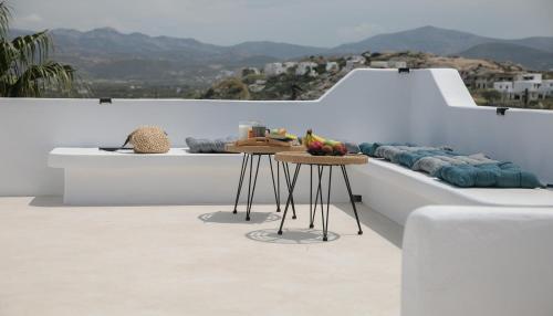 a couple of tables on the side of a couch at Villa Jardin De Stelida in Stelida