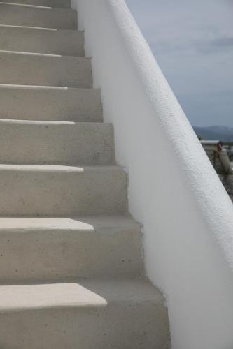 a set of stairs leading to the beach at Villa Jardin De Stelida in Stelida