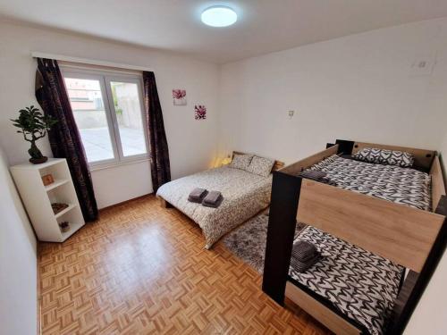 Katil atau katil-katil dalam bilik di Appartamento 4.5 - Gordola