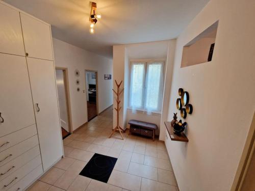 a room with a hallway with a large window at Appartamento 4.5 - Gordola in Gordola