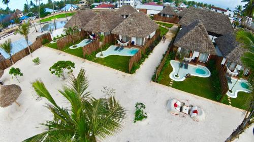 an aerial view of a resort with a swimming pool at Safaya Luxury Villas - Adults only in Nungwi