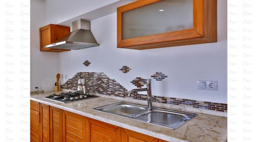 Kuchyň nebo kuchyňský kout v ubytování Çınarlar Apart Hotel KAŞ