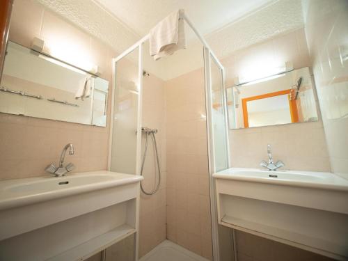 a bathroom with a sink and a mirror at Chalet Annapurna in Les Deux Alpes