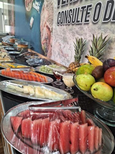 a buffet with various fruits and vegetables on display at Hotel Reserva do Xingó in Piranhas