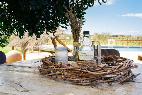 a bottle of alcohol sitting on top of a table at Agriturismo Sweet Cottage in Marina di Grosseto