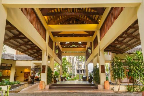 a lobby of a building with a wooden ceiling at Tanjung Rhu Resort in Tanjung Rhu 