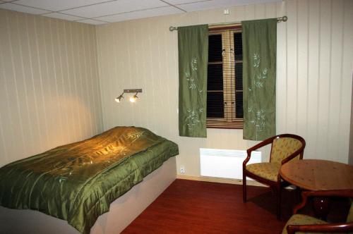 En eller flere senge i et værelse på Jergul Astu