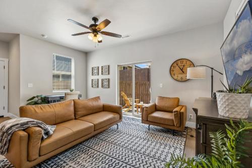 a living room with a couch and a ceiling fan at Serene Escape - Close to Sedona and Grand Canyon in Flagstaff