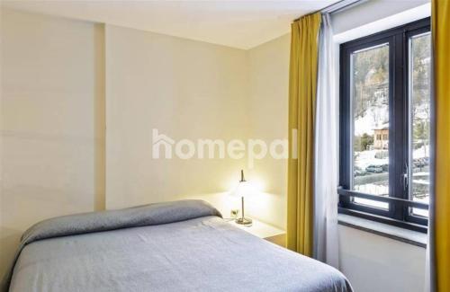 a bedroom with a bed and a window at Residence Universo in Pré-Saint-Didier