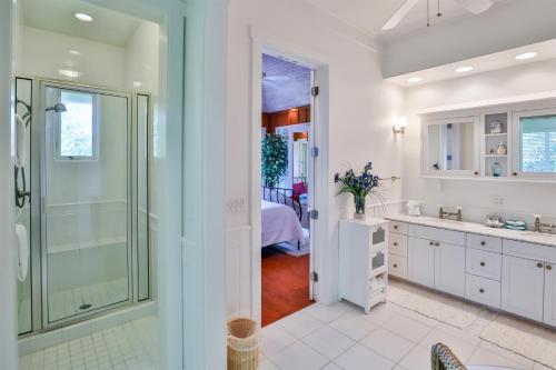 a bathroom with a walk in shower and a sink at ROOSEVELT COTTAGE in Captiva