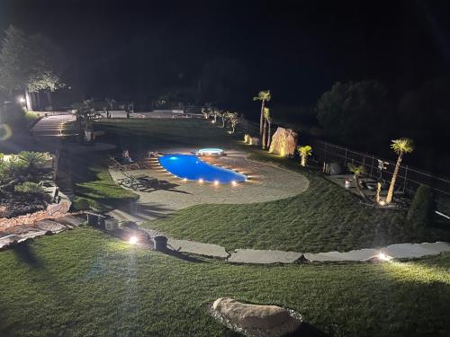 a large yard with a pool at night at I-relais b&b in Montefalcone del Sannio