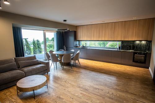 a living room with a couch and a table at Park Residence View in Baia Mare