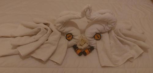 a towel with a stuffed animal on a bed at Kasbat Aferdou in Er Rachidia