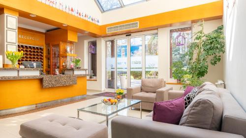 a living room with a couch and a table at Ledan in Chłopy