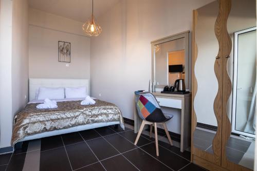 Postel nebo postele na pokoji v ubytování Votsalakia Hotel & Luxury Apartments