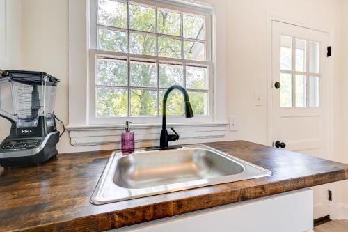a kitchen counter with a sink and a window at Winston-Salem Vacation Rental about 3 Mi to Downtown! in Winston-Salem