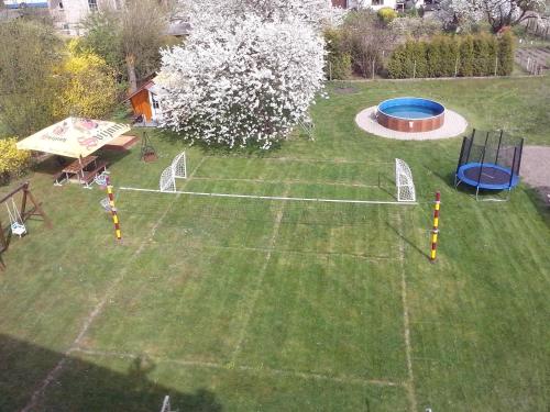 an aerial view of a backyard with a trampoline at Chalupa Erika in Dobšín