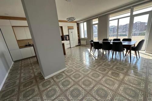 a dining room with a table and chairs at Gem in the Heart of Yerevan in Yerevan