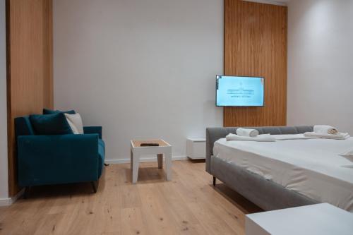 Postel nebo postele na pokoji v ubytování Britney's Apartments