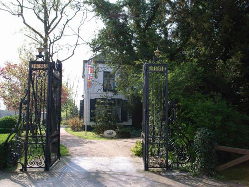 a pair of gates in front of a house at Hotel Pension 't Huys Grol in Renesse