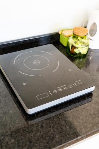 a tablet computer sitting on top of a counter at Casas Casal Do Carvalhal - Agroturismo in Amares