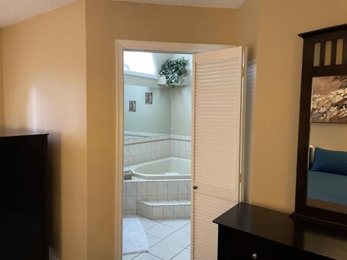 a bathroom with a bath tub and a bath tub at Beautiful Lake Harmony Townhouse with views of Big Boulder Lake in Lake Harmony