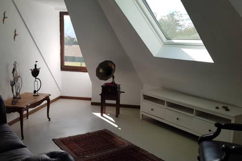 a living room with a window and a couch at Grand appartement 4/5 personnes in Bartrés