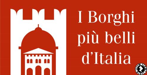 two banners with the words i borough pu bellilla and a mosque at Pizzocolo resort fasano in Gardone Riviera