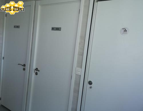 a group of three lockers in a room at Erletxe Aterpea in Lezo