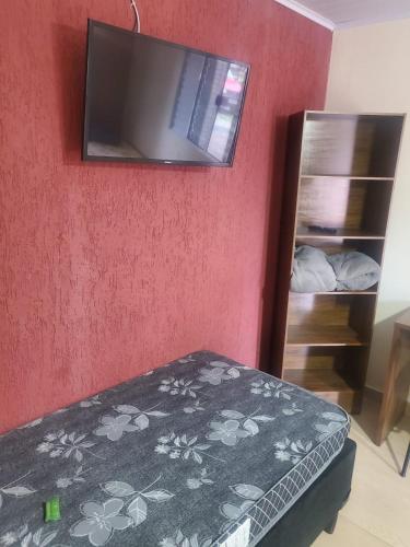 Televisyen dan/atau pusat hiburan di Pousada Doce Lar