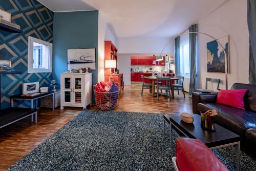 a living room with a couch and a table at H11 COUNTRY LUX - Sanremo - Garden in Sanremo
