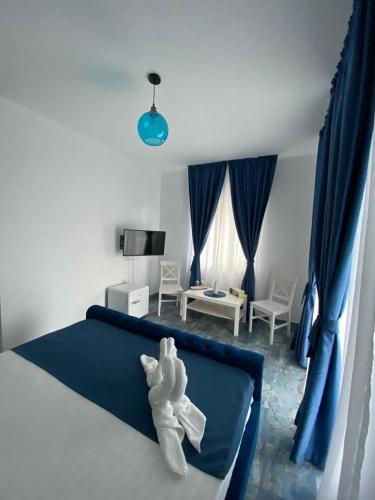 a bedroom with a bed with a stuffed animal on it at Casa Ortviken in Eforie Sud