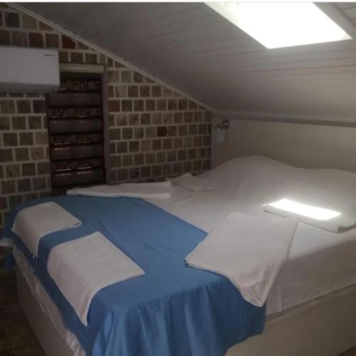 Ένα ή περισσότερα κρεβάτια σε δωμάτιο στο BAT Apart Otel