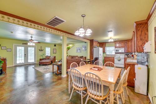 a kitchen and dining room with a table and chairs at Spacious Lake Texoma Vacation Rental with Game Room! in Kingston