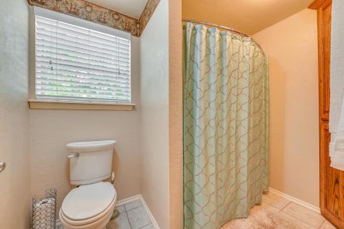a bathroom with a toilet and a shower at Spacious Lake Texoma Vacation Rental with Game Room! in Kingston
