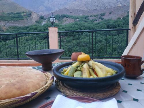 a bowl of food on a table with a view at Dar Amadine in Imlil