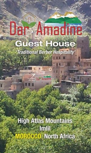 a sign for a guest house in a city at Dar Amadine in Imlil