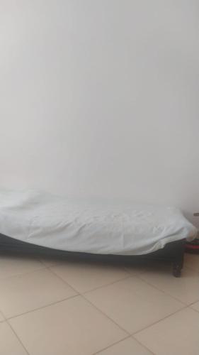 a bed sitting on the floor in a room at appartement one room in Casablanca