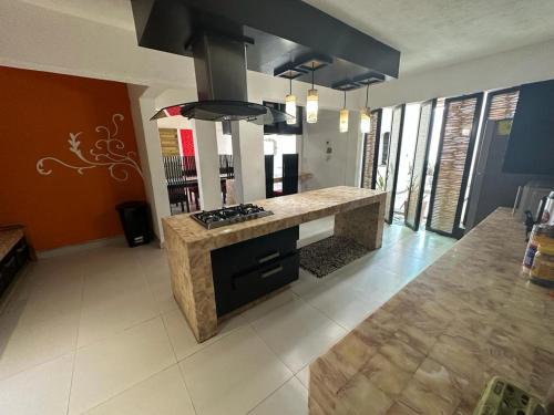 a kitchen with a stove and a counter top at Isla Cozumel in Acapulco