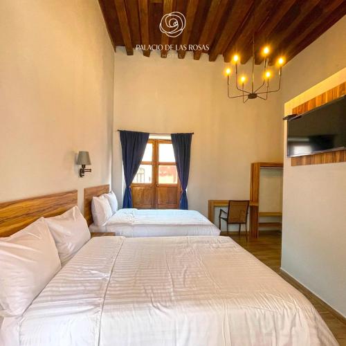 Cama o camas de una habitación en Palacio de las Rosas